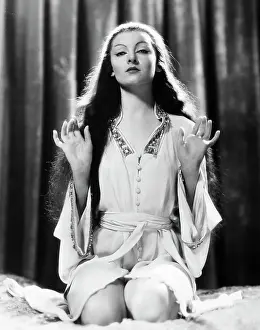 Myrna Loy Kneels W/Palms Up Movie Still