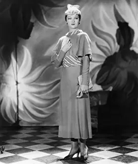 Myrna Loy Wearing Designer Dress and Matching Hat