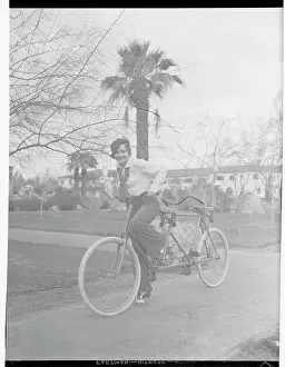Nancy Carroll Riding Bicycle