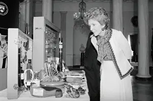 Nancy Reagan Gazing at Drug Use Tools