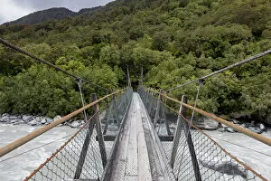 Narrow suspension bridge over the Fox River, Fox River, West Coast Region, New Zealand
