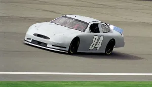 Prints of NASCAR Race Car Driver Shawna Robinson test driving racecar at Ontario Motor Speedway, April 3, 2001 in Ontario, California. (Photo by Bob Riha, Jr./Getty Images) Chasing Speed: Motorsport in Motion: NASCAR Race Car Driver Shawna Robinson