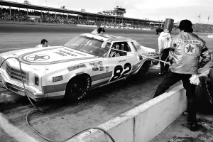 Prints of DAYTONA BEACH, FLORIDA - FEBRUARY 1980: NASCAR driver Janet Guthrie makes a pit stop during the running of the 1980 Daytona 500 stock car race at Daytona International Speedway in Daytona Beach Chasing Speed: Motorsport in Motion: NASCAR races and drivers