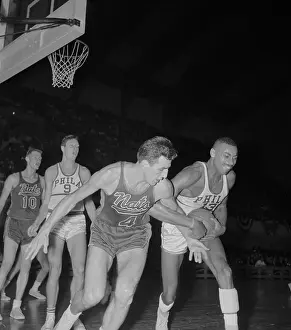 Prints of (Original Caption) Hoops Through Time: A Visual Journey of Basketball History: Nat Dolph Schayes and Wilt Chamberlain Fighting for Rebound