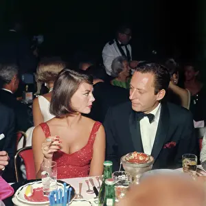 Prints of LOS ANGELES - 1964: American actress Natalie Wood (1938-1981) and American movie producer Arthur Loew Jr. (1925-1995) at the Cocoanut Grove nightclub in the Ambassador Hotel, Los Angeles, CA, 1964 Grace, Glamour & Timeless Elegance: Natalie Wood and Arthur Loew Jr