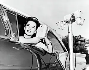 Prints of Natalie Wood displays the new drive in-movie speakers as she leans out of her car window, Hollywood, California, 1957. (Photo by Underwood Archives/Getty Images) Grace, Glamour & Timeless Elegance: Natalie Wood At A Drive-In
