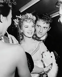 Prints of American actress Natalie Wood, wearing a floral crown, with American actor Robert Vaughn peering over Wood's shoulder as they attend a Halloween party in Los Angeles, California, 27th October 1956 Grace, Glamour & Timeless Elegance: Natalie Wood & Robert Vaughn, 1956