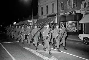 Bayonet Prints: National Guard Marching with Rifles During Riot