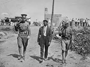 Louis Prints: National Guardsmen Escorting Man