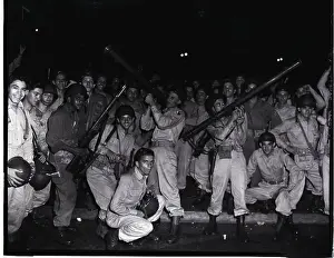 National Guardsmen Pose with Bazookas and Other Weapons
