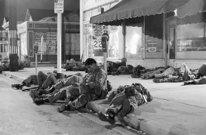 Watts Prints: National Guardsmen Sleep on Sidewalk after Watts Riots