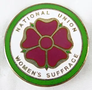Prints of Red, green, and white enamel pin with a stylized five-petalled red rose and the text National Union Women's Suffrage, manufactured by the National Union of Women Suffrage Societies (NUWSS) Historic Moments from the Women’s Fight for the Vote: National Union Suffrage Pin