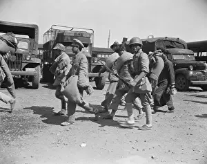 Nationalist Prints: Nationalist Troops March Captives Up Str
