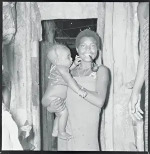 Native Woman with Baby Inside Hut