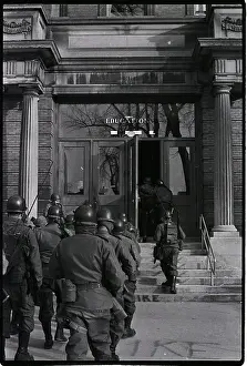 Natl Guaradsmen Enter College Building