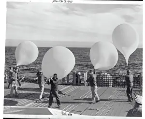 Naval Men on Vessel with Balloons to Launch into the Atmosphere