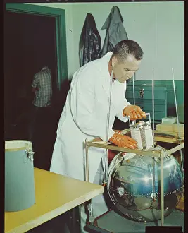 Moore Prints: Naval Research Employee with Laboratory Satellite