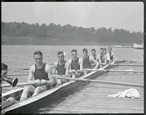 Endurance Prints: Navy Crew in Rowing Action
