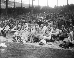 Blanket Prints: Navy Football Team Resting on Field