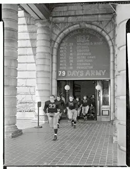 Annapolis Prints: Navy Varsity Football Team Running Through Doorway