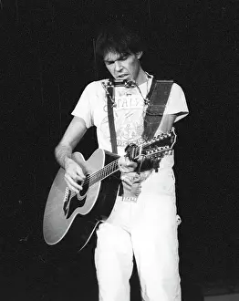 Prints of Musician Neil Young performing onstage in 1978 in Los Angeles. (Photo by Michael Ochs Archives/Getty Images) Echoes of a Legend: Celebrating the Enduring Spirit of a Music Icon: Neil Young Performing
