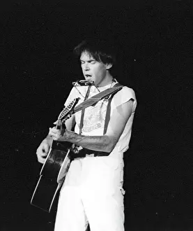 Prints of Musician Neil Young performing onstage in 1978 in Los Angeles. (Photo by Michael Ochs Archives/Getty Images) Echoes of a Legend: Celebrating the Enduring Spirit of a Music Icon: Neil Young Performing