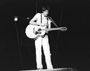 Prints of Musician Neil Young performing onstage in 1978 in Los Angeles. (Photo by Michael Ochs Archives/Getty Images) Echoes of a Legend: Celebrating the Enduring Spirit of a Music Icon: Neil Young Performing