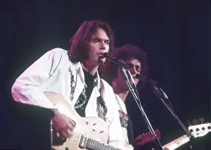 Prints of Musician Neil Young performs on stage onstage in circa 1984. California. (Photo by Michael Ochs Archives/Getty Images) Echoes of a Legend: Celebrating the Enduring Spirit of a Music Icon: Neil Young Performing