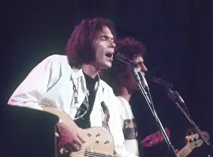 Prints of Musician Neil Young performs on stage onstage in circa 1984. California. (Photo by Michael Ochs Archives/Getty Images) Echoes of a Legend: Celebrating the Enduring Spirit of a Music Icon: Neil Young Performing