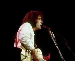 Prints of Musician Neil Young performs on stage onstage in circa 1984. California. (Photo by Michael Ochs Archives/Getty Images) Echoes of a Legend: Celebrating the Enduring Spirit of a Music Icon: Neil Young Performing