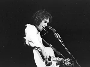 Prints of Musician Neil Young performs on stage onstage in circa 1984. California. (Photo by Michael Ochs Archives/Getty Images) Echoes of a Legend: Celebrating the Enduring Spirit of a Music Icon: Neil Young Performing