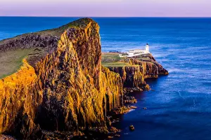 Prints of A long exposure shot at Neist Point lighthouse on the Isle of Skye during twilight Lighthouse Prints: Neist Point lighthouse - viewpoint on the most westerly point on the Isle of Skye