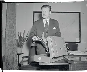Nelson A. Rockefeller Standing at His Desk