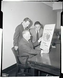 William M Prints: Nelson Rockefeller Reading A Poster