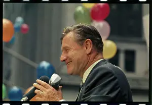 Nelson Rockefeller Smiling at Microphones