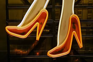 Vibrant Neon Art Collection: Part of neon light sign, red high heels