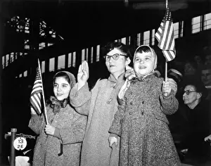 Citizenship Prints: Three New Americans Smiling, Waving Flag