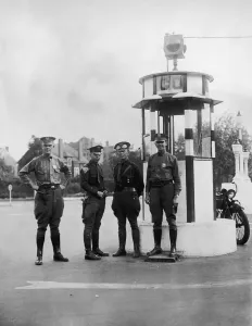 Prints of Two New Jersey State policemen (centre) with two traffic policemen waiting to escort a witness to The Hall-Mills Murder Trial, 1926. (Photo by FPG/Hulton Archive/Getty Images) Black and White Images Capturing the Essence of Mid-20th Century: New Jersey Police