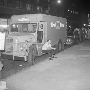Delivery Prints: New York Herald Tribune Deliveryman Sits Idly on Truck