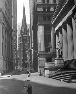 New York. View up Wall St. of Trinity Ch