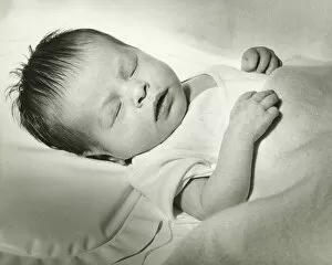 Images Dated 5th May 2006: Newborn (0-3 months) sleeping in crib, (B&W)