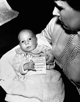 Newborn Prints: A Newborn Holding a Social Security Card