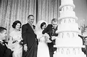 Reception Prints: Newlyweds Mr. and Mrs. Nugent Cut Wedding Cake