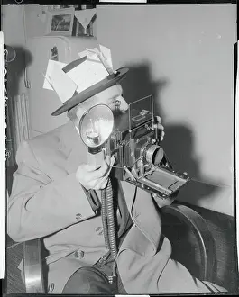 News Photographer Holding His Camera
