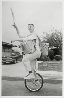 Newspaper Prints: Newsboy Delivering Papers on Unicycle