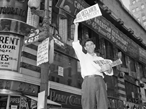 Headline Prints: Newsboy Holds Paper with War Declaration
