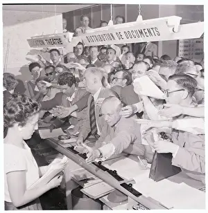 Newsmen Crowding a Counter