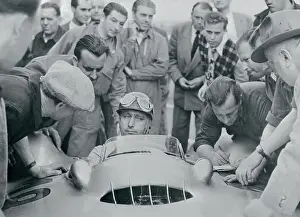 Reims Prints: Newsmen and Mechanics Surround Driver Juan Manuel Fangio