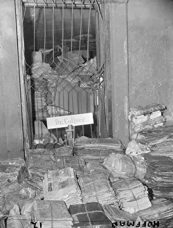 Newspapers Piled High in a Room