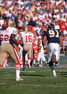 NFL San Francisco 49ers - QB # 16 Joe Montana, RD # 62 Guy McIntyre and S.D. Charger DE # 91 Leslie O'Neal